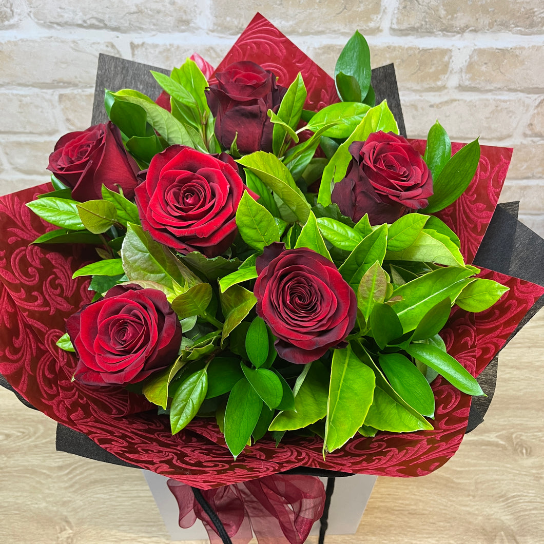 HALF DOZEN ROSES WELLINGTON FLOWER CO.